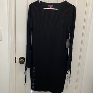 Black Vince Camuto straight dress with tie details at cuff. Size m. NWT.